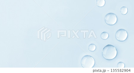 Drops of cosmetics on a blue background 135582904