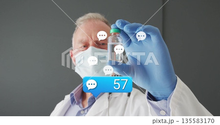 Inspecting doctor in lab coat holding vial at clinic, with floating chat bubbles message overlay 135583170