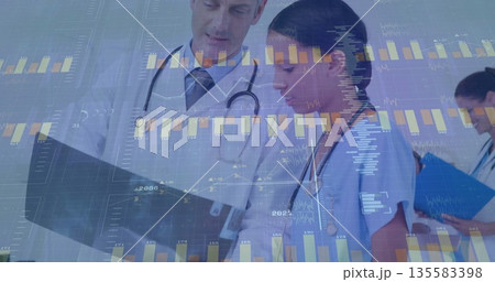 Examining physician and nurse reviewing clipboard chart in corridor with stethoscopes, data overlay 135583398
