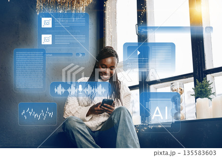 Woman using smartphone near window with digital interfaces in modern room 135583603