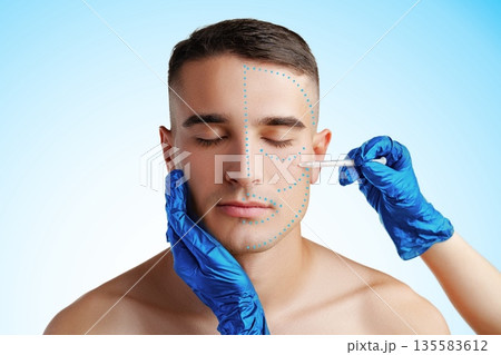 Male model receiving facial treatment in a clinical setting during daytime Male model receiving facial treatment in a clinical setting during daytime 135583612