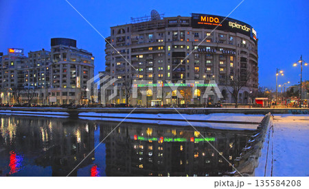 Bucharest, Romania - January 9, 2019: Winter nightscape in Bucharest. Modern buildings in Bucharest city, Romania. 135584208