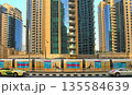 Dubai, UAE - May 08, 2018: Travel tramcar in the area of Dubai Marina. A view of street at Jumeirah Beach Residence and Dubai marina timelapse hyperlapse, United Arab Emirates.  Dubai, UAE. -May 08, 135584639
