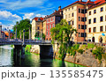 LJUBLJANA, SLOVENIA -  JUNE 28, 2014: Old town embankment in Ljubljana. Ljubljana is the business and cultural center of the country. 135585475