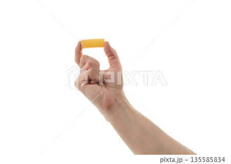 Adult man hand hold dry rigatoni pasta isolated on whit background Adult man hand hold dry rigatoni pasta isolated on whit background 135585834