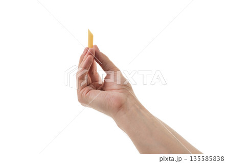 Adult man hand hold dry penne rigate pasta isolated on whit background 135585838