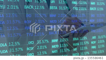 Financial analyst wearing white blazer holding clipboard and pen reviewing data overlay at office Financial analyst wearing white blazer holding clipboard and pen reviewing data overlay at office 135586461