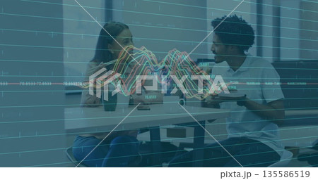 Colleagues eating lunch in break room, with chopsticks, coffee mugs, smartphone, line graph Colleagues eating lunch in break room, with chopsticks, coffee mugs, smartphone, line graph 135586519