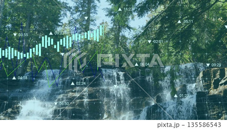 Flowing waterfall cascading over layered rock ledges in forest with digital charts overlay 135586543