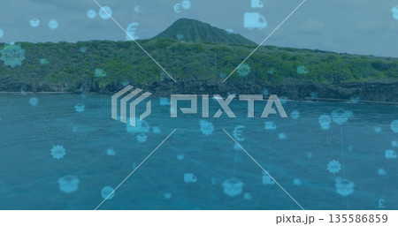 Displaying volcanic island peak rising over coastal turquoise sea, featuring digital overlay icons Displaying volcanic island peak rising over coastal turquoise sea, featuring digital overlay icons 135586859