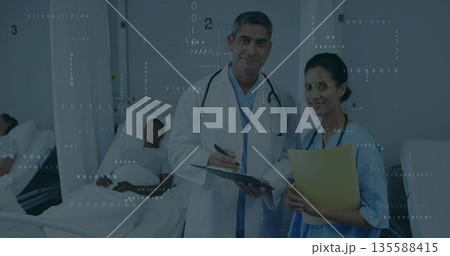 Reviewing medical file White male doctor consulting beside beds in ward, with privacy curtains Reviewing medical file White male doctor consulting beside beds in ward, with privacy curtains 135588415