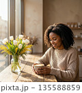 Cozy Morning Coffee Moments with Spring Floral Bouquets in a Sunlit Interior 135588859