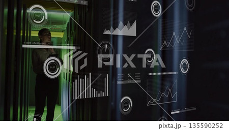 Scanning business-casual IT tech holding phone, viewing AR charts amid server racks, copy space 135590252