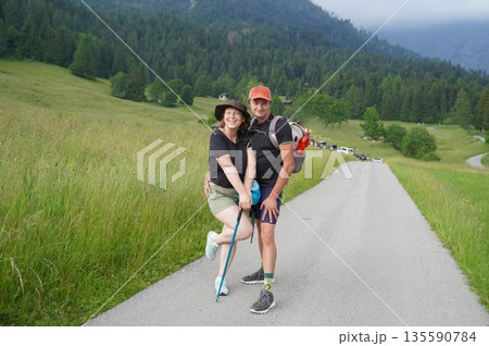 Couple Enjoying a Scenic Hike in the Countryside Couple Enjoying a Scenic Hike in the Countryside 135590784