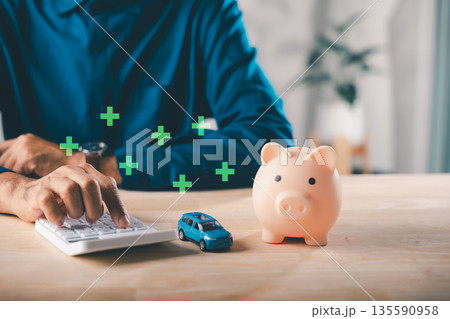 Car auto loan money saving with piggy bank, insurance for tax safety, person calculates debt management, ensuring financial growth with smart future planning and wise decisions 135590958