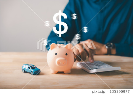 Person calculates car loan money, saving funds in piggy bank for auto insurance, tax management, budgeting future expenses, financial planning ensures long term safety Person calculates car loan money, saving funds in piggy bank for auto insurance, tax management, budgeting future expenses, financial planning ensures long term safety 135590977