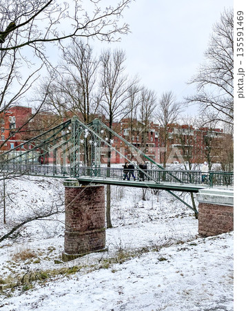A Beautiful Winter Scene featuring an Ornate Bridge amidst a Stunning Snowy Landscape 135591469