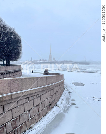 A winter landscape highlighting the charm of St. Petersburg with snow and historic architecture A winter landscape highlighting the charm of St. Petersburg with snow and historic architecture 135591550