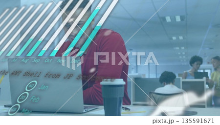 Working red-sweatered man with glasses analyzing laptop data in open-plan office holding coffee cup Working red-sweatered man with glasses analyzing laptop data in open-plan office holding coffee cup 135591671