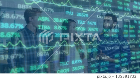 Group of three analysts analyzing stocks on transparent display at trading floor with smartphone 135591732