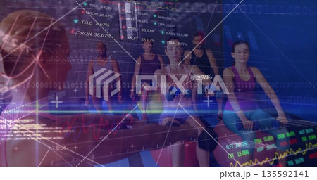 Rowing six exercisers in sportswear pulling on rowing machines at gym, with digital data overlays 135592141