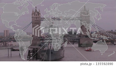 Tower Bridge spanning Thames quayside, showing retired warship passenger boat world map overlay 135592890
