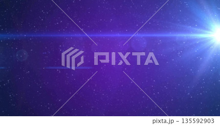 Radiating white-blue star generating lens flares, horizontal streaks in outer space, copy space 135592903