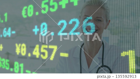 Analyzing doctor in lab coat and stethoscope viewing digital currency rates in clinic, copy space Analyzing doctor in lab coat and stethoscope viewing digital currency rates in clinic, copy space 135592913