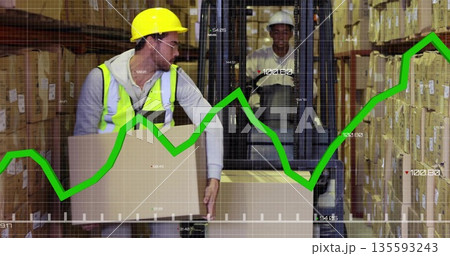 Worker in yellow helmet, safety vest lifting cardboard box in warehouse with forklift, green graph Worker in yellow helmet, safety vest lifting cardboard box in warehouse with forklift, green graph 135593243