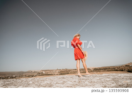 Woman in Red Dress on a Sunny Day Woman in Red Dress on a Sunny Day 135593908