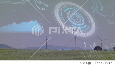 Showcasing three wind turbines displaying digital overlays in green grass field, line chart and HUD 135594947