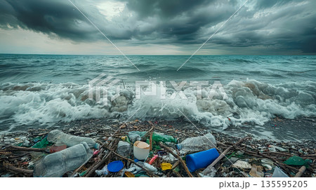 Polluted beach with plastic waste and stormy sea 135595205