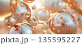 Abstract golden spheres floating in soft light 135595227