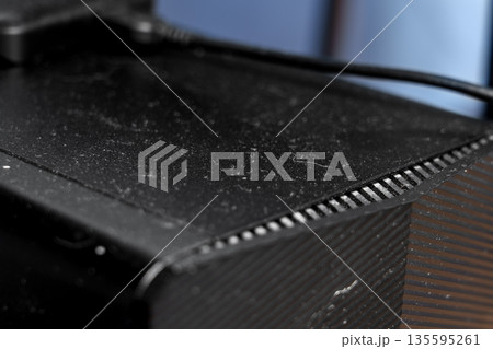 Dusty office computer with external memory drive on top close up Dusty office computer with external memory drive on top close up 135595261