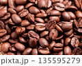 Roasted aromatic Arabica coffee beans. Close-up. An organic morning beverage ingredient. 135595279