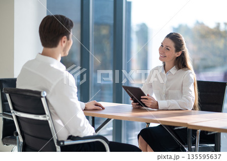 HR manager having an interview with a male candidate in the office HR manager having an interview with a male candidate in the office 135595637