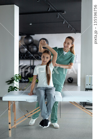 Pediatric physiotherapy exercise improving arm function Pediatric physiotherapy exercise improving arm function 135596756