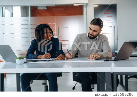 Modern office. Two men are working 135599296