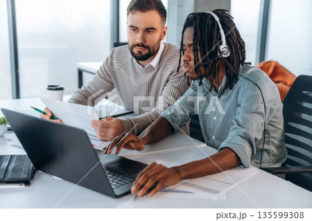 Modern office. Two men are working Modern office. Two men are working 135599308