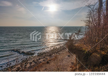 Sunlight over the Baltic Sea from Groemitz cliffs 135599444