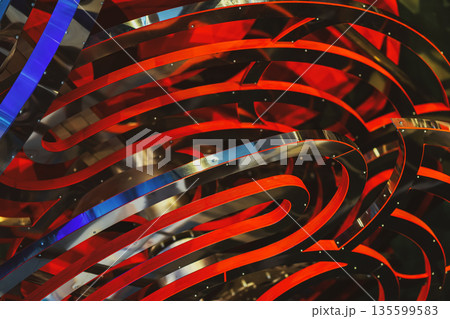 Wavy copper texture, smooth, shiny, brushed metallic surface. Abstract background with red and metallic curved ribbons creating dynamic visual rhythm. Modern design, movement, futuristic structure Wavy copper texture, smooth, shiny, brushed metallic surface. Abstract background with red and metallic curved ribbons creating dynamic visual rhythm. Modern design, movement, futuristic structure 135599583