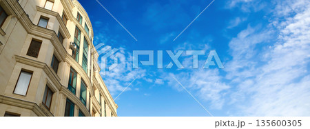 Classic European style apartment building facade with empty space banner Classic European style apartment building facade with empty space banner 135600305