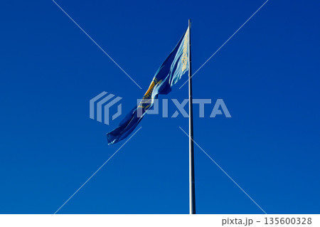 Flag of Kazakhstan against blue sky 135600328