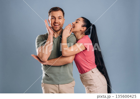 Gossip time, funny couple. Man and woman are in the studio Gossip time, funny couple. Man and woman are in the studio 135600425