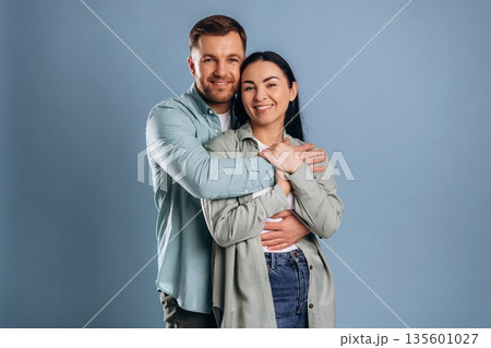 Cute couple having fun. Man and woman are in the studio 135601027