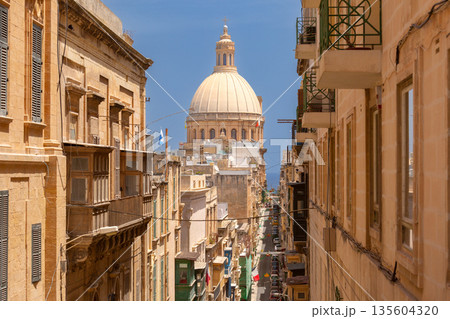 Street view with dome of Basilica of Our Lady of Mount Carmel, Valletta, Malta Street view with dome of Basilica of Our Lady of Mount Carmel, Valletta, Malta 135604320