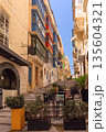 Colorful balconies on a narrow street in Valletta, Malta 135604321