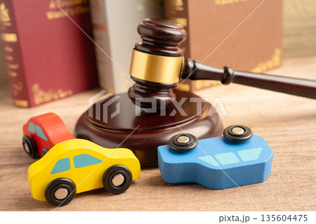 Car accident lawsuit and insurance, Judge hammer with car model. Car accident lawsuit and insurance, Judge hammer with car model. 135604475