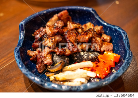 Grilled sliced marinated pork collar, served on the plate 135604604