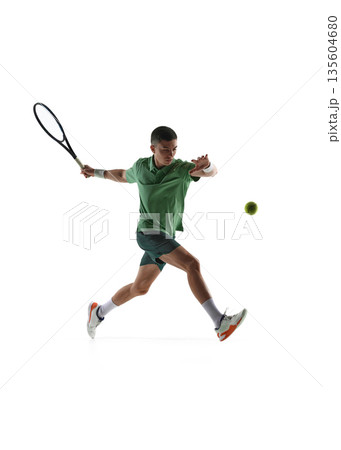 Tennis player mid air forehand swing isolated on white background. Tennis player mid air forehand swing isolated on white background. 135604680
